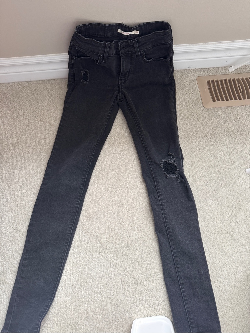 Levi's Women's Skinny Jeans in Black with Distressed Knees